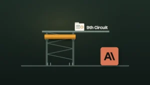 An amber beam sits lifted and parked high in a steel hoist shaft above empty floor brackets, while a small case file rests unresolved on an upper level marked "9th Circuit," and a tile bearing the Anthropic logo stands free on the ground floor.