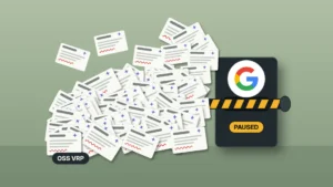 Illustration on a sage green field of a pile of identical white bug report cards, each marked with a sparkle and a red squiggle, jammed against a dark intake gate bearing the Google G logo with a lowered striped barrier across its slot and a chip reading PAUSED, beside a chip reading OSS VRP.