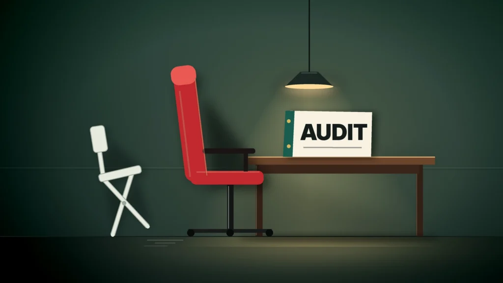 News illustration: in a dim green audit room, a tall red leather executive chair is pulled up to a wooden table under a hanging lamp, where a white binder labeled AUDIT stands, while a small pale folding chair has been pushed away to the left, tipping backward with skid marks on the floor.