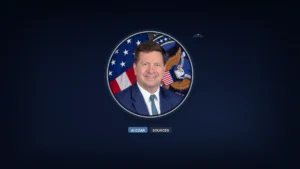 Official ODNI portrait of Jay Clayton, U.S. Director of National Intelligence, in a circular frame on a deep navy field with chips reading AI CZAR and SOURCES.