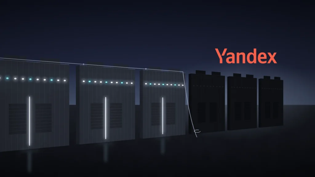 A row of boxy prefabricated data center modules at night recedes to the right. The nearest modules glow with white and cyan status lights, while the last three are completely dark in a cold haze, with a slack cable hanging to the ground. The Yandex wordmark in coral red sits in the dark sky above the dark modules.